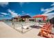 Gathering-friendly community pool with colorful splash pad, lounge chairs, and umbrellas for shade at 13212 E Verbina Ln, Florence, AZ 85132