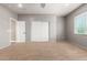 Bedroom featuring carpet, closet and windows at 13259 W Flower St, Litchfield Park, AZ 85340