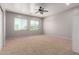 Bedroom featuring carpet, ceiling fan and windows at 13259 W Flower St, Litchfield Park, AZ 85340