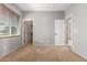Bedroom featuring carpet, window and two doors at 13259 W Flower St, Litchfield Park, AZ 85340