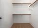 Walk-in closet with bar and shelving at 13259 W Flower St, Litchfield Park, AZ 85340