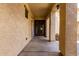 Home featuring a covered front patio entryway and textured stucco under a bright blue sky at 13259 W Flower St, Litchfield Park, AZ 85340