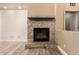 Close-up of the stone fireplace featuring a detailed mantel at 13259 W Flower St, Litchfield Park, AZ 85340