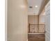 Hallway featuring wood-look floors, neutral walls, and a view of the staircase at 13259 W Flower St, Litchfield Park, AZ 85340