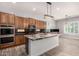 Bright kitchen featuring a large island and built-in oven at 13259 W Flower St, Litchfield Park, AZ 85340