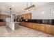 Spacious kitchen featuring custom cabinets and a center island at 13259 W Flower St, Litchfield Park, AZ 85340
