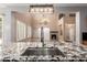 Open concept kitchen featuring granite countertops and island at 13259 W Flower St, Litchfield Park, AZ 85340