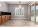 Dining area featuring custom cabinets and pool views at 13259 W Flower St, Litchfield Park, AZ 85340