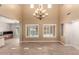 Bright living room showcasing backyard pool access with tile flooring at 13259 W Flower St, Litchfield Park, AZ 85340