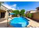 Sparkling pool featuring fountains and lush landscaping for a private oasis at 13259 W Flower St, Litchfield Park, AZ 85340