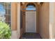 Inviting front entryway featuring decorative screen door and transom window allowing natural light at 13421 W Ocotillo Ln, Surprise, AZ 85374