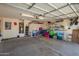 Spacious garage featuring storage solutions, lighting, and ample room for parking and projects at 13421 W Ocotillo Ln, Surprise, AZ 85374