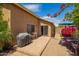 Cozy outdoor patio featuring a grill, dining set, and mature landscaping for delightful outdoor enjoyment at 13421 W Ocotillo Ln, Surprise, AZ 85374