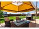 Spacious backyard featuring a patio, fire pit, seating area and playset at 14008 N 61St Ave, Glendale, AZ 85306