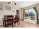 The dining area features tile flooring, a dining table, and access to the backyard at 14008 N 61St Ave, Glendale, AZ 85306