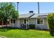 Single-story house with a well-kept lawn and a inviting front porch at 14008 N 61St Ave, Glendale, AZ 85306
