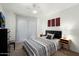 Comfortable bedroom with a ceiling fan, carpeted floors, and bedside tables at 14203 N 19Th Ave # 1031, Phoenix, AZ 85023