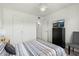 Bright bedroom with ceiling fan, side tables, and a nearby closet at 14203 N 19Th Ave # 1031, Phoenix, AZ 85023