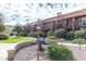 Attractive condo building with balconies, desert landscaping, and a community barbecue area at 14203 N 19Th Ave # 1031, Phoenix, AZ 85023