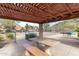 Relaxing outdoor area with picnic tables, barbecue grills, and desert landscaping at 14203 N 19Th Ave # 1031, Phoenix, AZ 85023