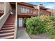 Charming two-story home featuring a cozy porch, stairs, and vibrant landscaping at 14203 N 19Th Ave # 1031, Phoenix, AZ 85023