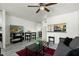 Cozy living room with modern decor, a ceiling fan, and an open layout to the kitchen at 14203 N 19Th Ave # 1031, Phoenix, AZ 85023