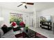 Bright living room with modern decor, including a ceiling fan, and comfortable seating at 14203 N 19Th Ave # 1031, Phoenix, AZ 85023