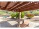Community picnic area with a table, benches, and lush greenery at 14203 N 19Th Ave # 1031, Phoenix, AZ 85023