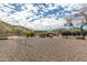 Community playground with swing set, picnic tables, and beautiful mountain backdrop at 14203 N 19Th Ave # 1031, Phoenix, AZ 85023