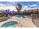Community pool and hot tub area surrounded by well-maintained landscaping at 14203 N 19Th Ave # 1031, Phoenix, AZ 85023