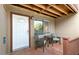 A cozy porch with a table and chairs awaits guests at the front door at 14203 N 19Th Ave # 1031, Phoenix, AZ 85023