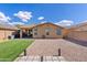 Expansive backyard with artificial turf and a patio, perfect for outdoor activities and relaxation at 1462 E Poncho Ln, San Tan Valley, AZ 85143