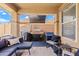 Relaxing covered patio, complete with grill, comfortable seating, and stylish decor for outdoor enjoyment at 1462 E Poncho Ln, San Tan Valley, AZ 85143