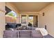 Cozy covered patio featuring comfortable seating, perfect for enjoying outdoor living and entertaining at 1462 E Poncho Ln, San Tan Valley, AZ 85143