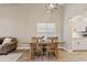 Cozy dining room with a rustic wooden table, seating for four, and ample natural light at 1462 E Poncho Ln, San Tan Valley, AZ 85143