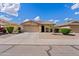 Charming single-story home with a well-maintained front yard and attached two-car garage at 1462 E Poncho Ln, San Tan Valley, AZ 85143
