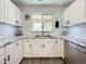 Bright kitchen featuring white cabinets, granite countertops, and stainless steel appliances at 1462 E Poncho Ln, San Tan Valley, AZ 85143