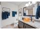 Bathroom vanity featuring granite countertops, a bowl sink, and updated fixtures at 15380 N 100Th St # 1124, Scottsdale, AZ 85260