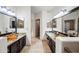 Bathroom with double vanities and granite countertops with bowl sinks at 15380 N 100Th St # 1124, Scottsdale, AZ 85260