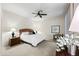 Bright bedroom featuring a ceiling fan, carpet, and ample natural light at 15380 N 100Th St # 1124, Scottsdale, AZ 85260