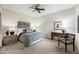 Bedroom with neutral tones, ceiling fan, and curated decor and furnishings at 15380 N 100Th St # 1124, Scottsdale, AZ 85260