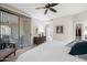 Bright bedroom with ceiling fan and sliding glass door to a private patio at 15380 N 100Th St # 1124, Scottsdale, AZ 85260