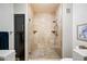Modern bathroom featuring a glass enclosed shower with stone tile surround at 15380 N 100Th St # 1124, Scottsdale, AZ 85260