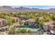 Scenic community aerial featuring lush landscaping, homes, and a tennis court at 15380 N 100Th St # 1124, Scottsdale, AZ 85260