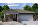 Charming single-story home with a welcoming entryway and a two-car garage at 15644 W Deanne Dr, Waddell, AZ 85355