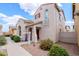 Charming exterior view of a two-story home, featuring a red-tile roof and desert landscaping at 16017 N 19Th Dr, Phoenix, AZ 85023