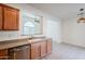 Well-lit kitchen boasts a practical open design with stainless steel appliances and neutral countertops at 16017 N 19Th Dr, Phoenix, AZ 85023