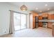 Open concept kitchen featuring sliding glass doors to patio, wooden cabinetry, and stainless appliances at 16017 N 19Th Dr, Phoenix, AZ 85023