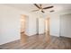 Large main bedroom featuring wood floors, ceiling fan and natural lighting at 16017 N 19Th Dr, Phoenix, AZ 85023