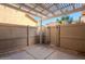 The cozy, covered patio includes a stylish pergola and privacy fencing at 16017 N 19Th Dr, Phoenix, AZ 85023